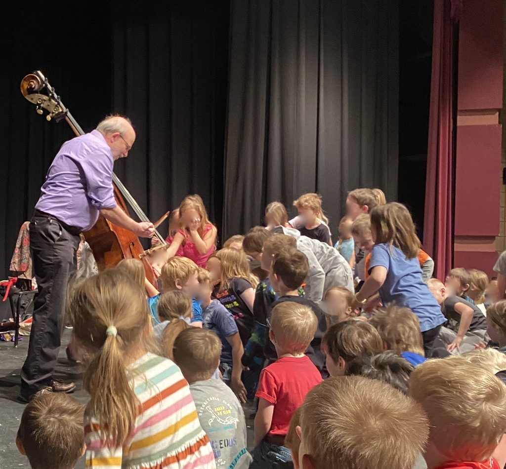 Students get to touch the double bass.